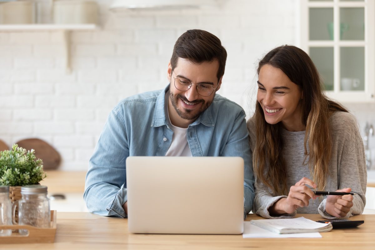 young-couple-on-laptop-at-home