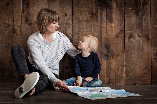Woman and child with map for Canada Child Benefit