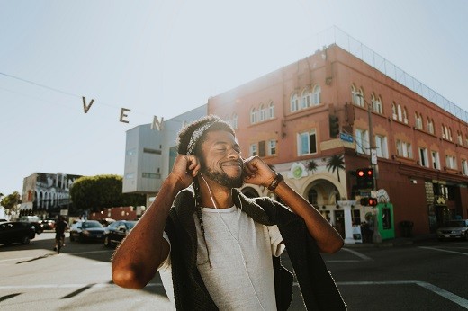 Man with headphones architecture - Educators Financial Group