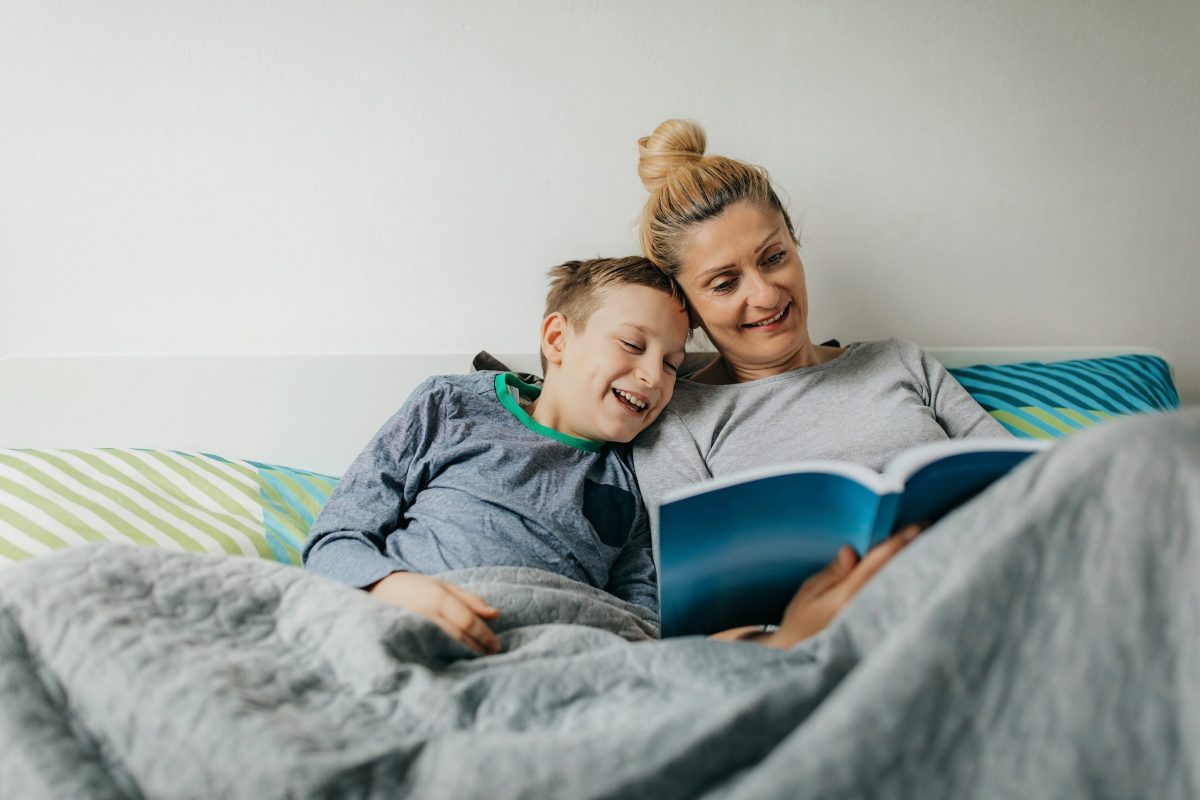 Mother and son in bedroom spend some quality time