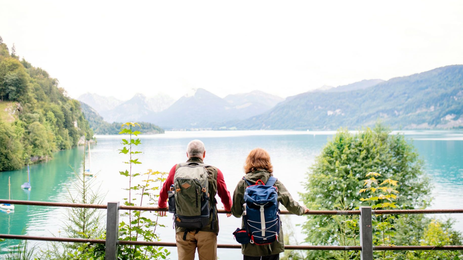 retired-man-and-woman-travelling-world-sightseeing-mountains