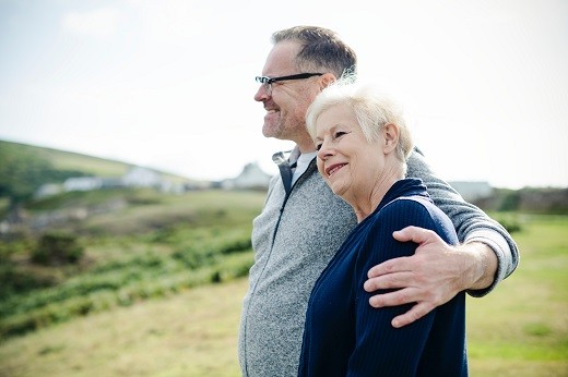 Old man holding older woman - Educators Financial Group