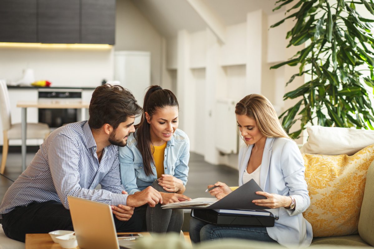 couple-discussing-financial-options-with-financial-specialist