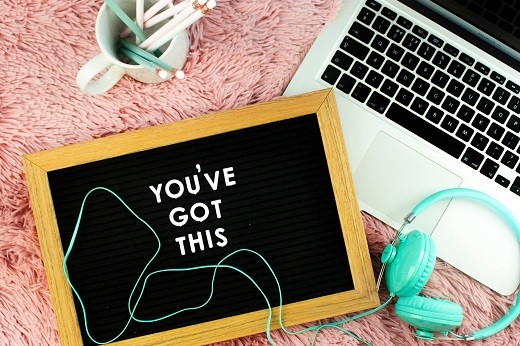 Blue corded headphones and board