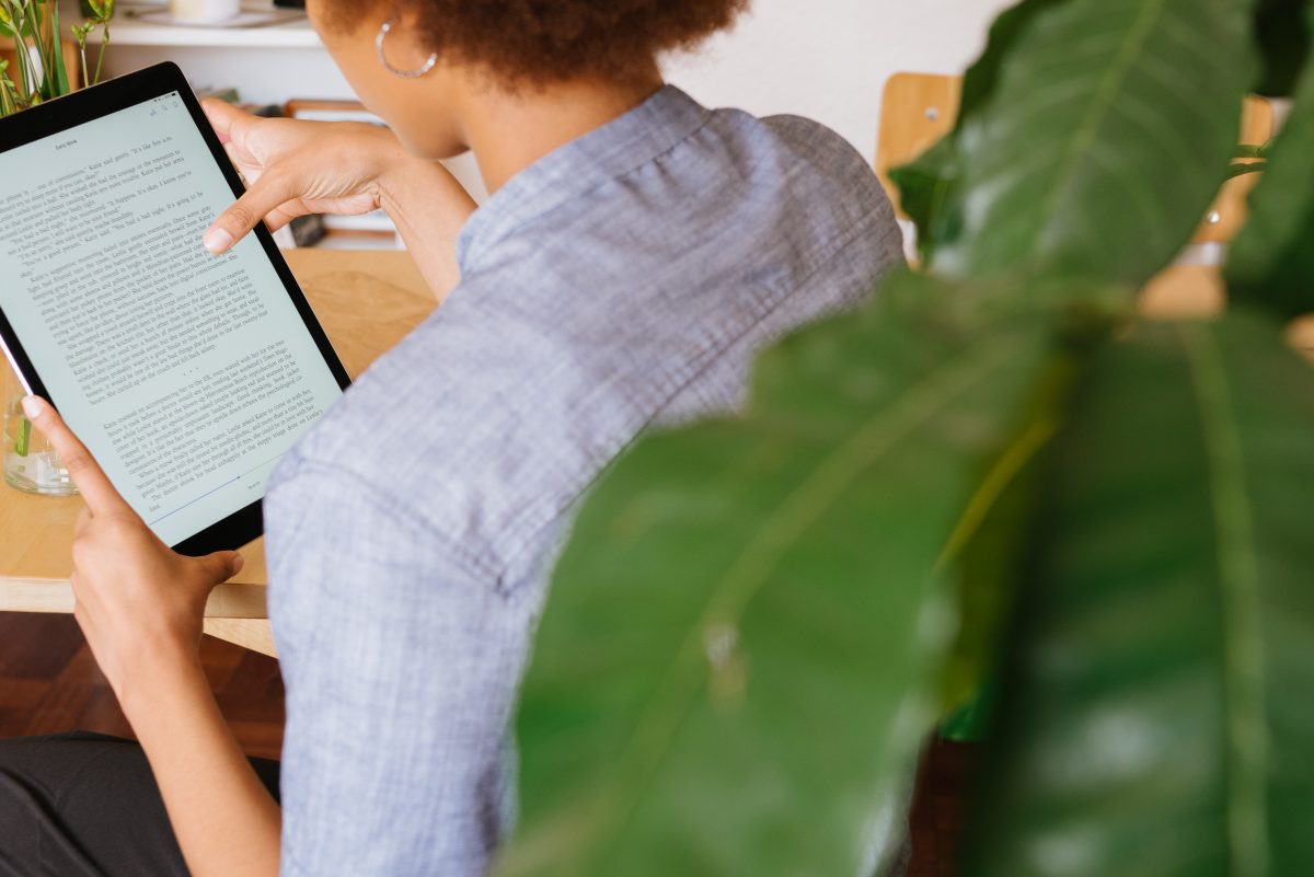 photo-of-woman-reading-on-tablet