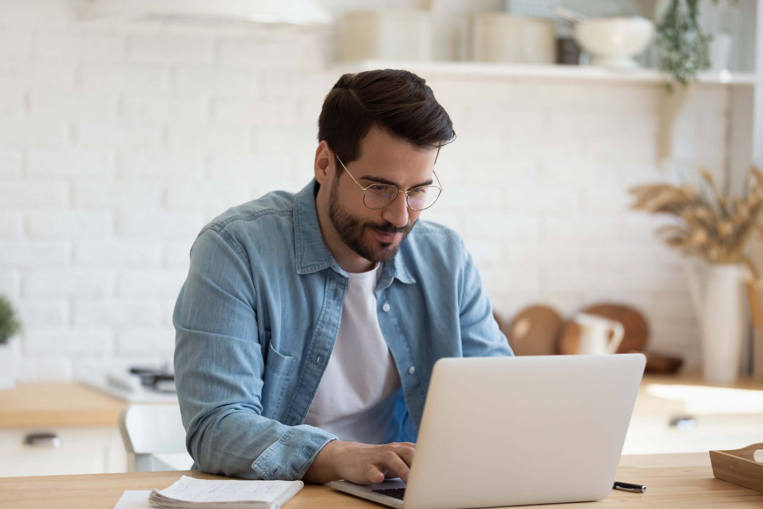 Man sitting using laptop