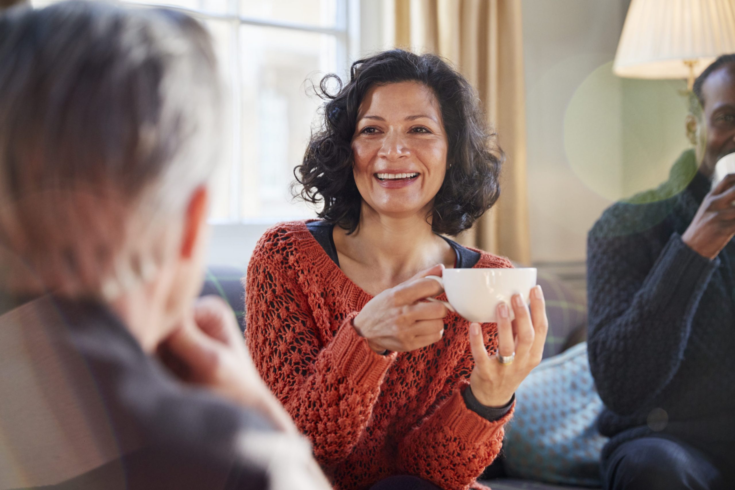 Middle Aged Woman Meeting Advisor Around Table In Coffee Shop