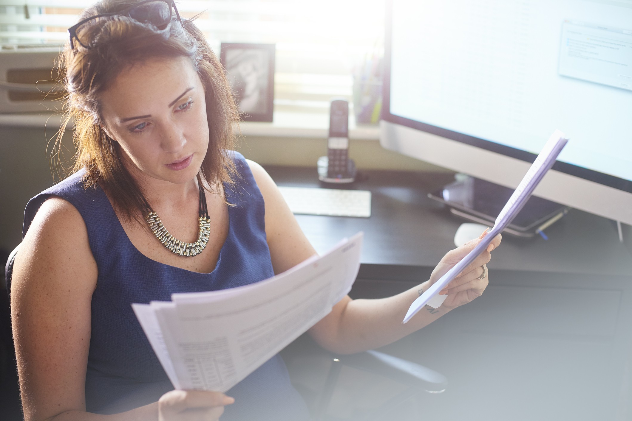 Woman reads through documents